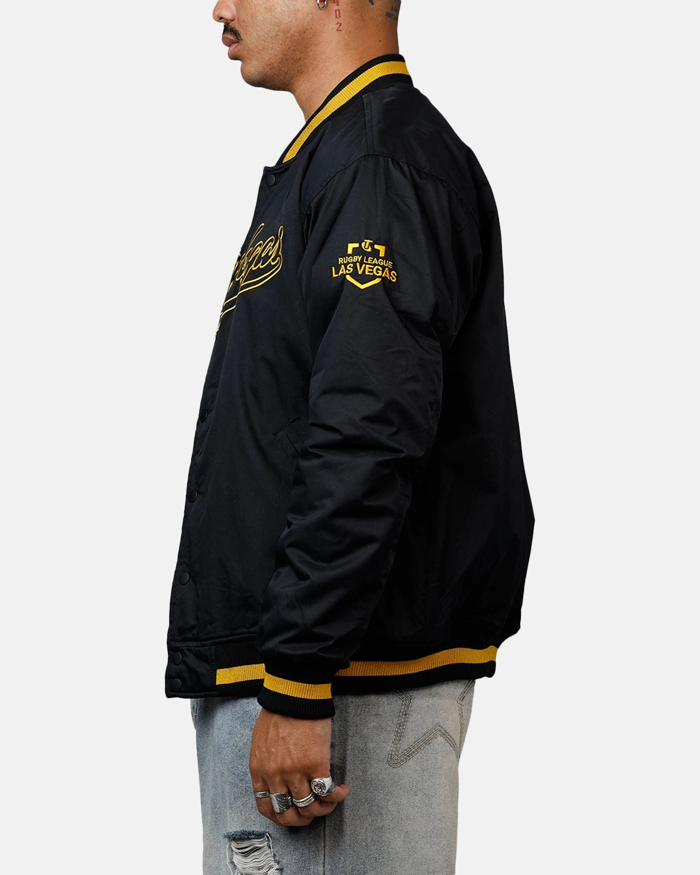 Bleacher Athletic NRL 2025 Las Vegas Round Bomber Jacket Black/Gold Emblem Outerwear