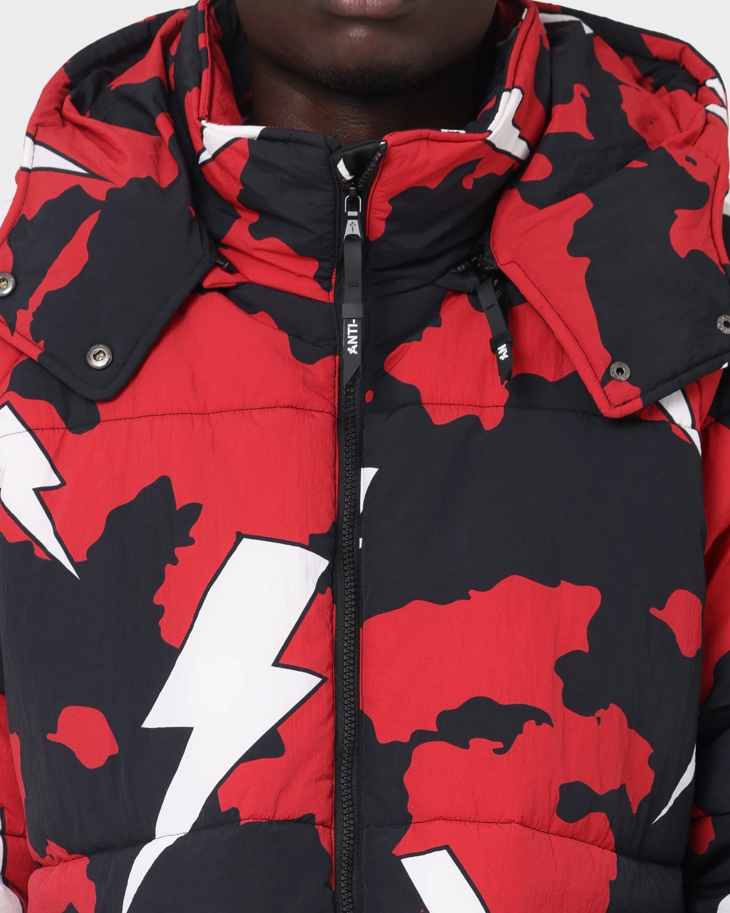 The Anti Order Storm Camo Puffer Jacket Black/Red/White Road Trip city lights