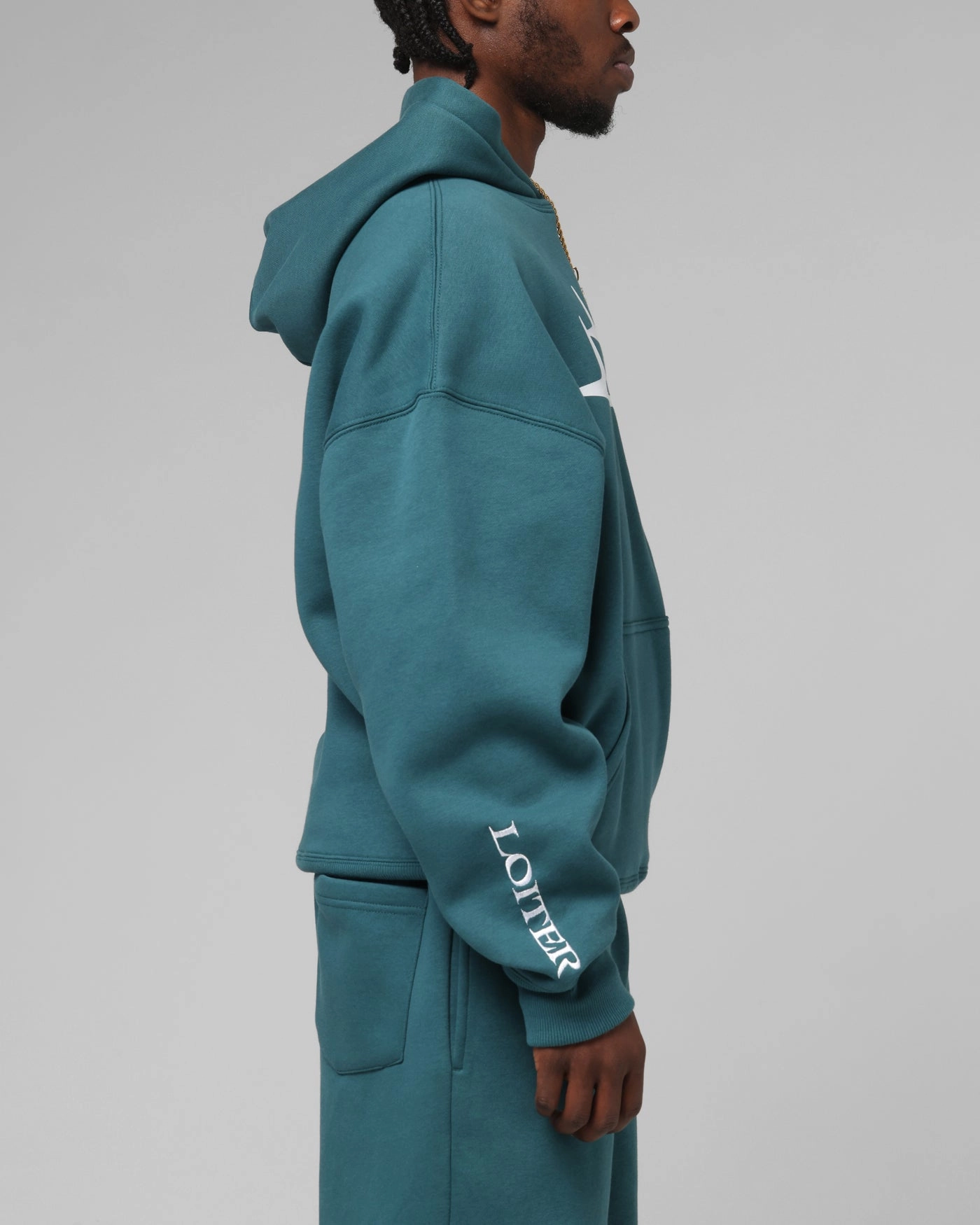 Loiter Hybrid Premium Hoodie Teal Fashion Week Compact Storage Design